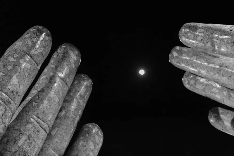 Moon between fingers of the Chico Hands on a night in February, 2016 - Waxing Gibbous